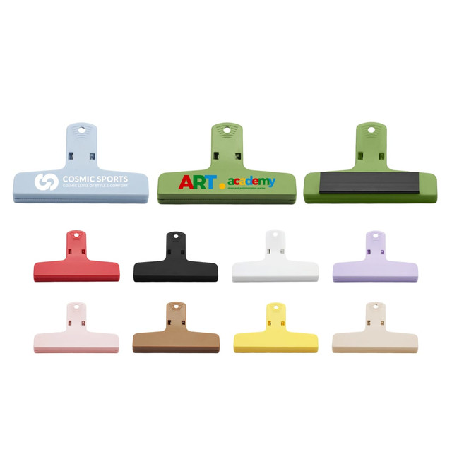 Plastic magnetic clips in various colours including green, blue, pink, black, white, purple, and yellow, featuring logos.