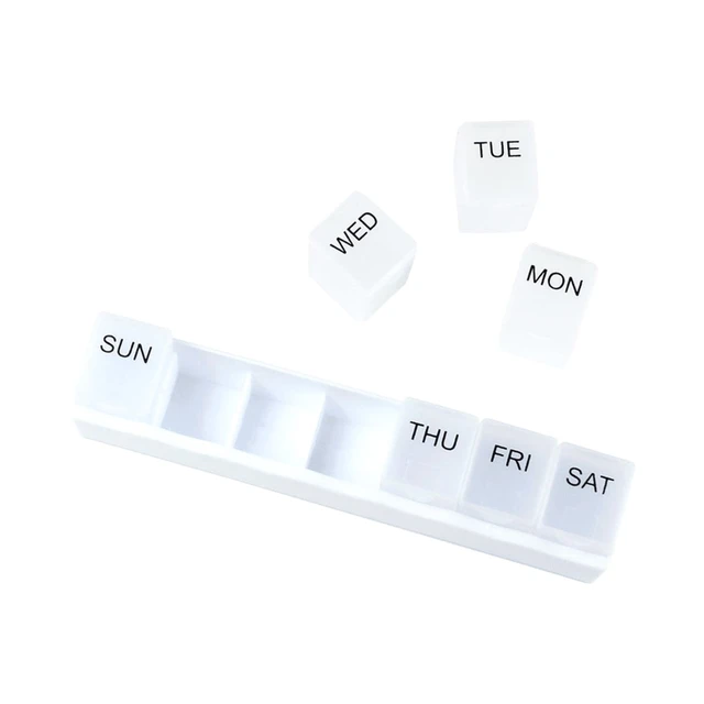 A white weekly pill organiser with compartments for each day of the week and removable labels for Monday to Sunday.