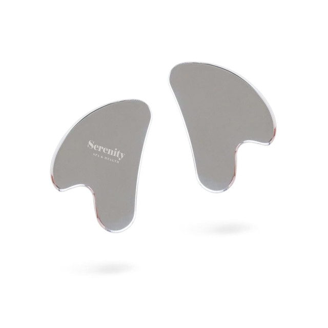 A stainless steel Gua Sha massage tool in silver, featuring a logo, with a smooth, curved design.