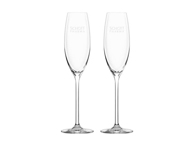 A pair of clear glass flute champagne glasses with slender stems and an etched logo.