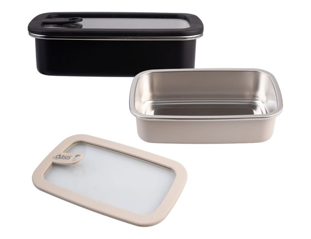A rectangular stainless steel container in silver with a black lid, accompanied by a beige-lidded container.
