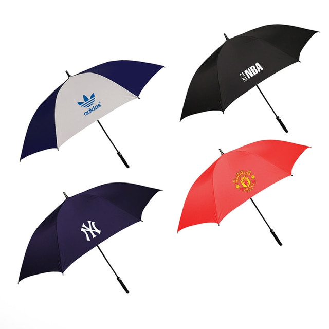 A collection of four golf umbrellas in navy, white, black, and red, each featuring different logos.