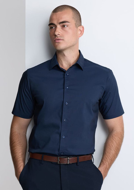 A classic fit short sleeve shirt in navy, featuring a button-up front and a subtle branding logo.