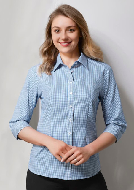 A women's button-up shirt in blue and white check pattern with 3/4 sleeves, featuring a collar and buttons. A women's button-up shirt in blue and white check pattern with 3/4 sleeves, featuring a collar and buttons.