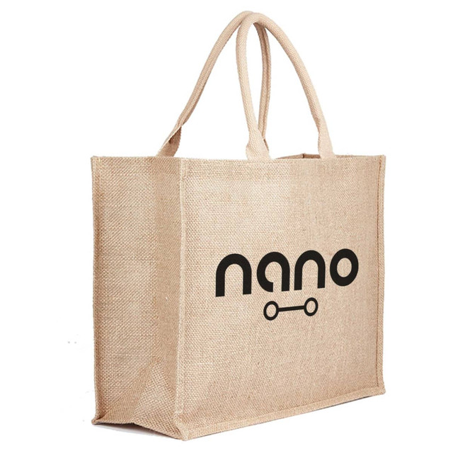 A natural jute bag in beige with two handles and a logo design. Ideal for reusable grocery needs.