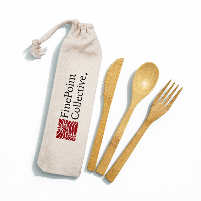 A bamboo cutlery set featuring a fork, knife, and spoon in a calico pouch with branding.