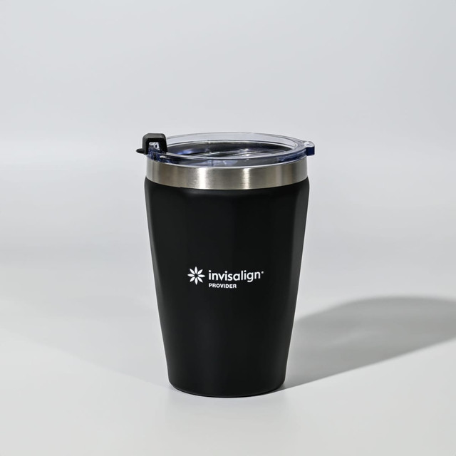 A drink bottle with a black exterior and a stainless steel band, featuring a clear lid and branding.