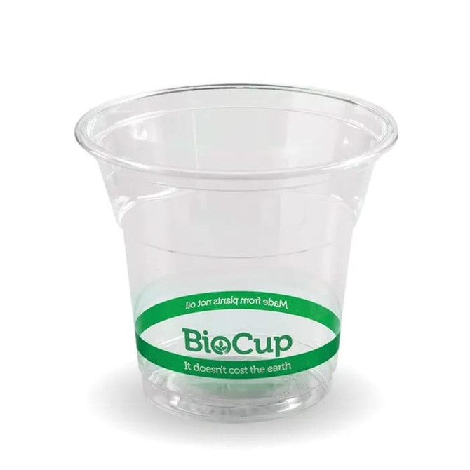 A clear, disposable plastic cup with a green band and branding. Suitable for beverages or snacks.