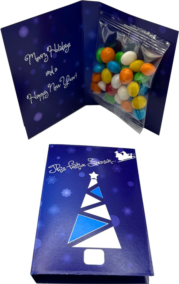 A festive gift card in blue, containing a transparent bag filled with colourful chewy fruit treats.