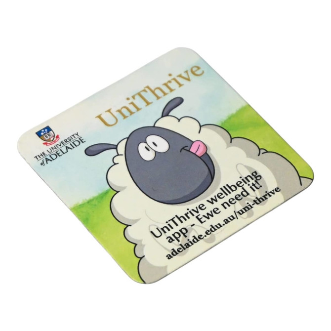 A square fridge magnet featuring a cartoon sheep in shades of green and white, with a logo at the top.