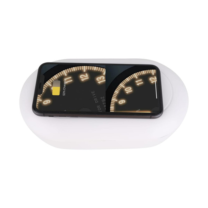A white UV sterilisation box with a wireless charger on top, featuring a smartphone placed on it.