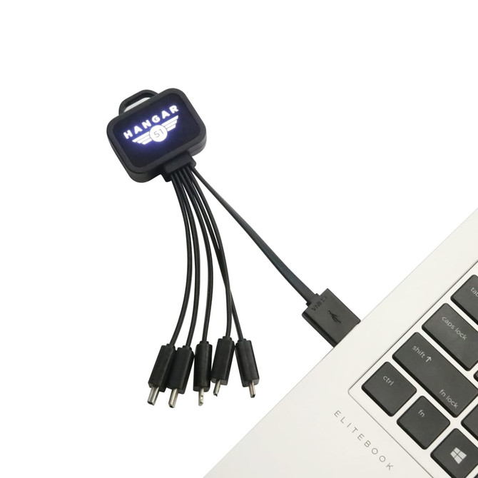 A square-shaped light-up charging cable featuring multiple connectors, in black, connected to a laptop.