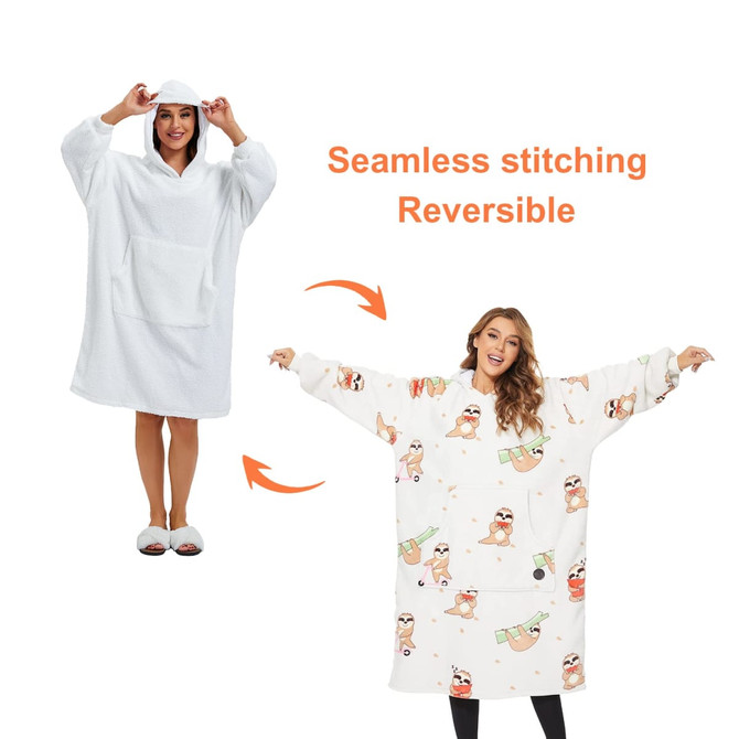A reversible unisex wearable blanket in white and a patterned design, featuring a hood and large sleeves.