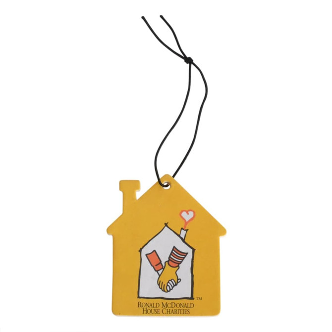 A yellow car air freshener shaped like a house, featuring an illustration of hands and a logo.