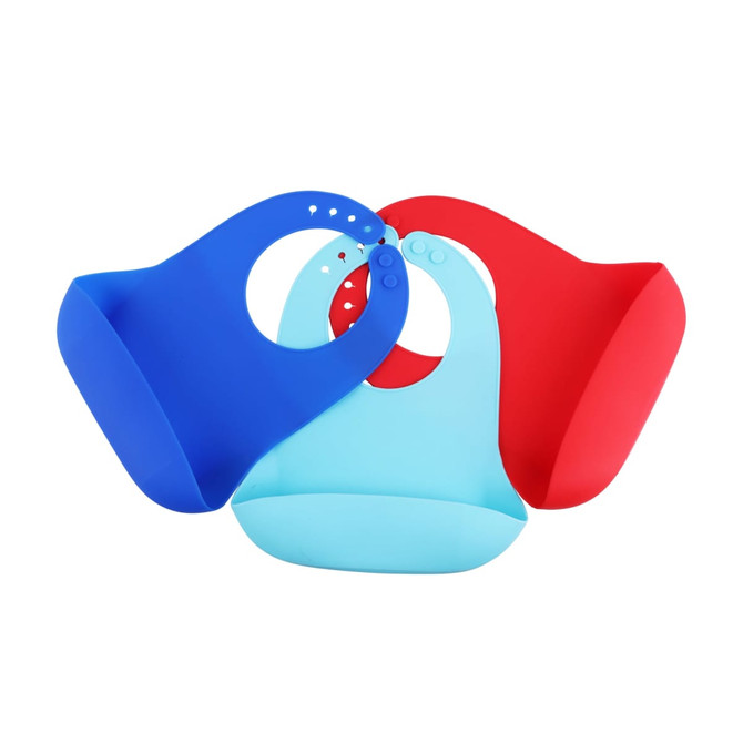 Three silicone bibs in blue, light blue, and red, featuring snap closures. The bibs have a logo displayed on them.