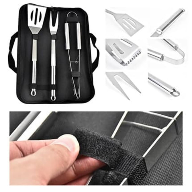 A set of stainless steel barbecue tools including a spatula, tongs, and a fork, stored in a black pouch.
