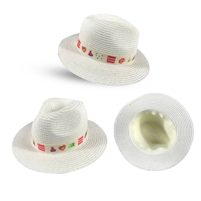 A white straw hat with a decorative ribbon featuring various small icons and a logo.