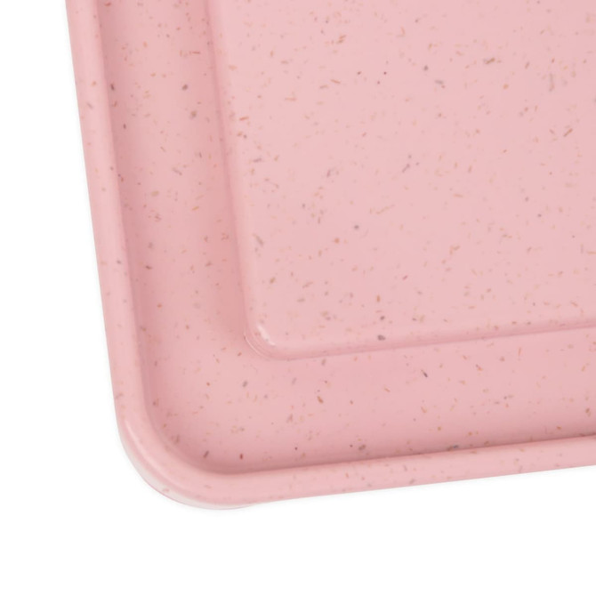 A pink portable bamboo fibre lunch box with a smooth finish and subtle speckled texture. It has a logo.