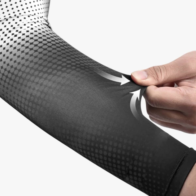 A black and white arm sleeve featuring a gradient design and a logo, highlighted by a hand pulling at the fabric.