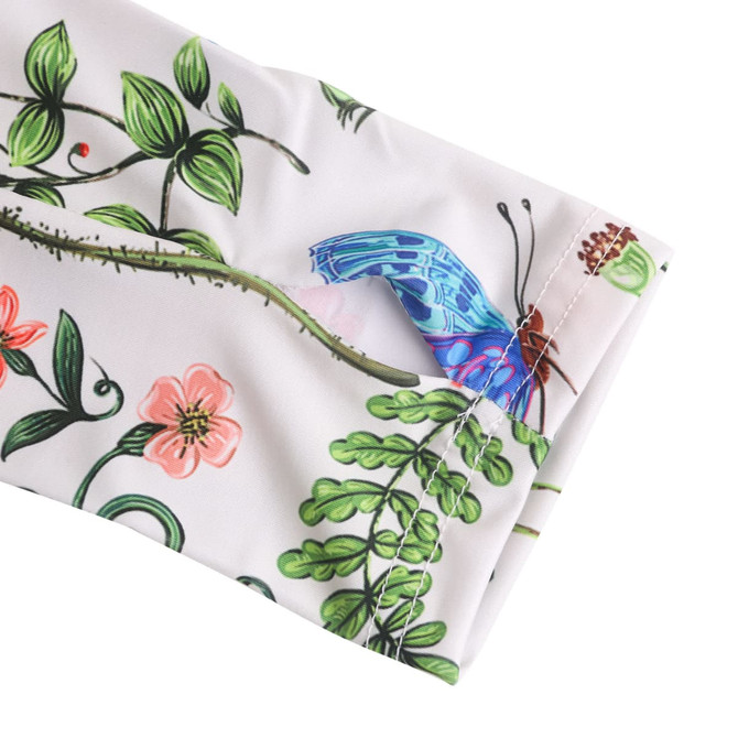A floral-patterned ice silk arm sleeve featuring vibrant colours and a butterfly design, with a visible logo.