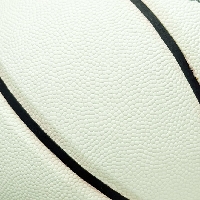 A white basketball featuring a textured surface and black detailing, with a logo present.