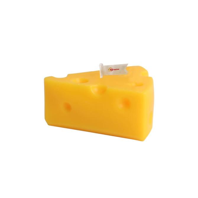 A triangular, yellow candle shaped like a cheese wedge, featuring holes and a small flag.