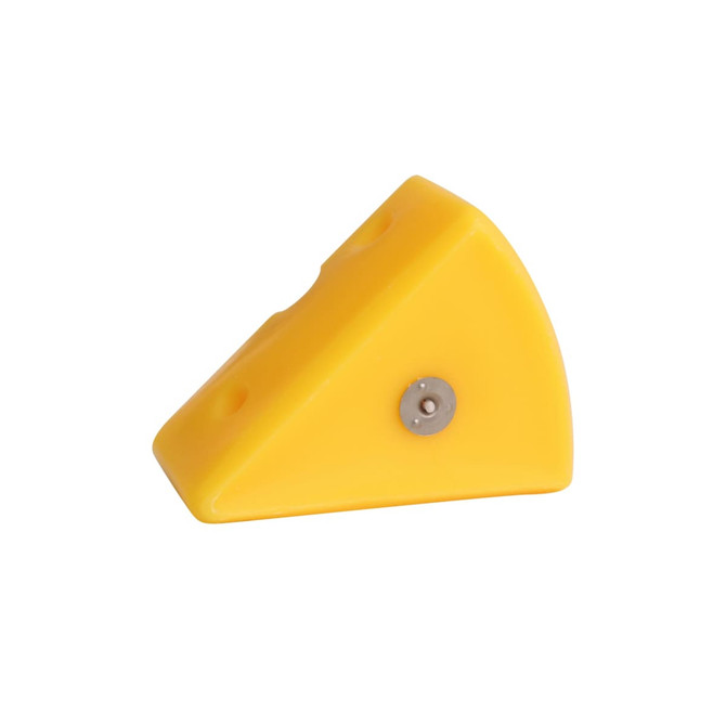 A yellow triangle-shaped candle with small holes, resembling a piece of cheese, features a metal base.