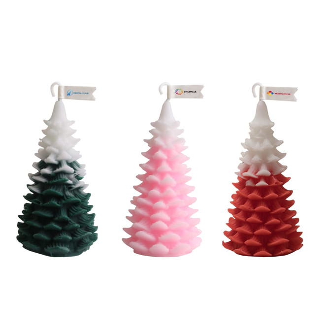 Cedar Christmas tree-shaped candles in green, pink, and red, featuring a decorative logo flag on each.