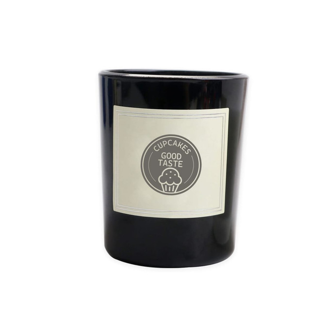 A black glass candle with a cream label featuring a circular logo and text. Ideal for home decor.