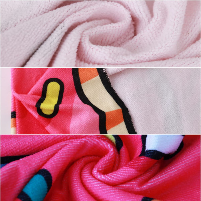A custom-shaped beach towel featuring a pink background with vibrant patterns in red, yellow, and blue, showcasing its soft texture.