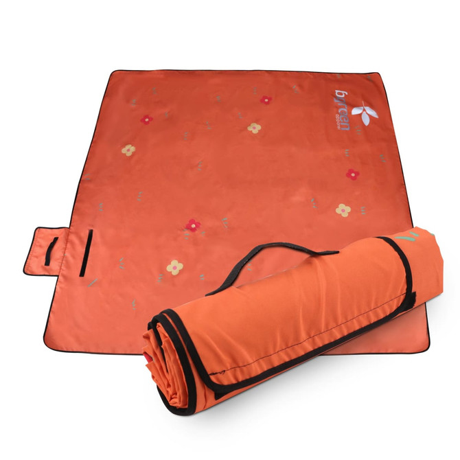 An orange picnic blanket, 200x200cm, features floral patterns and rolls up for easy transport with a handle.