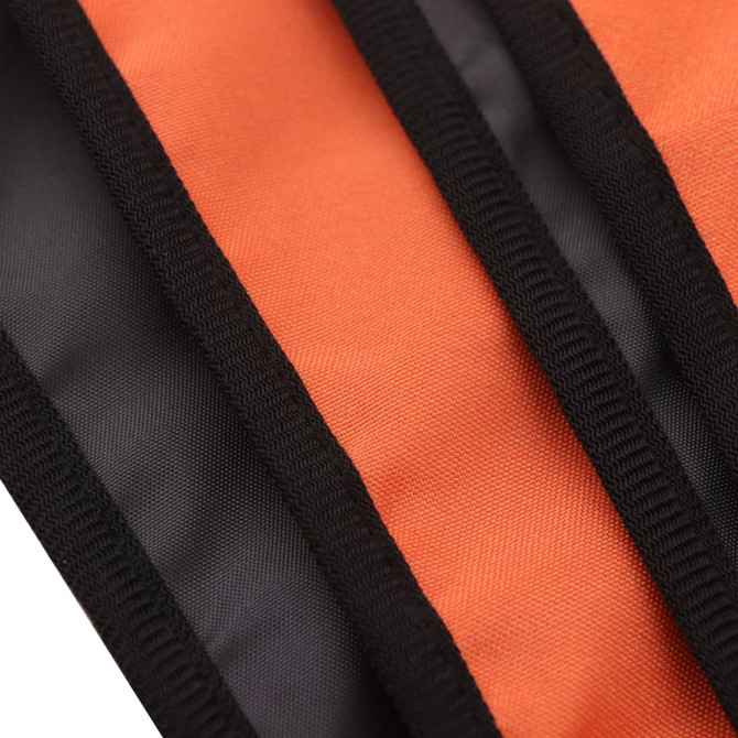 An orange and black picnic blanket with stitched edges, showcasing the texture and colour contrast.