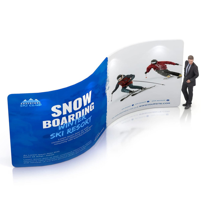 A curved, colourful S-shaped fabric display wall featuring images of skiers, with a person standing next to it for scale.
