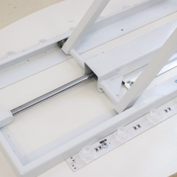 A white backlit LED spring-up display frame with adjustable components and buttons for operation.