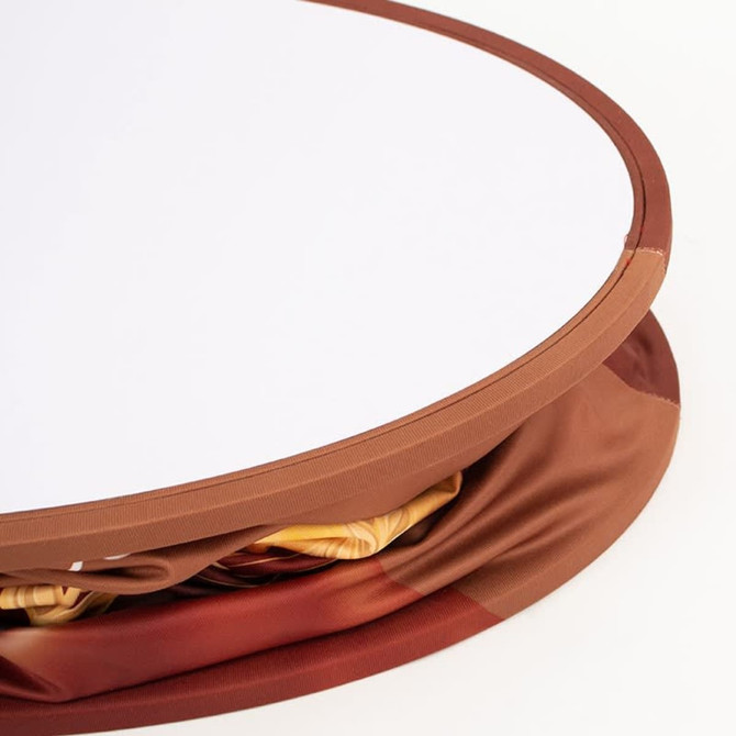 A backlit LED spring-up display in an oval shape, featuring a brown frame and a smooth, white surface.