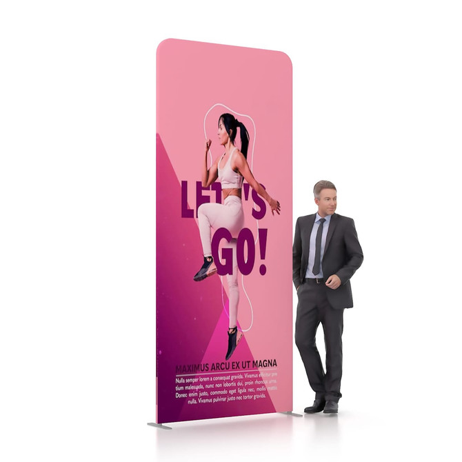A pink tension fabric display wall featuring a figure in a dynamic pose, with a man in a suit standing beside it.