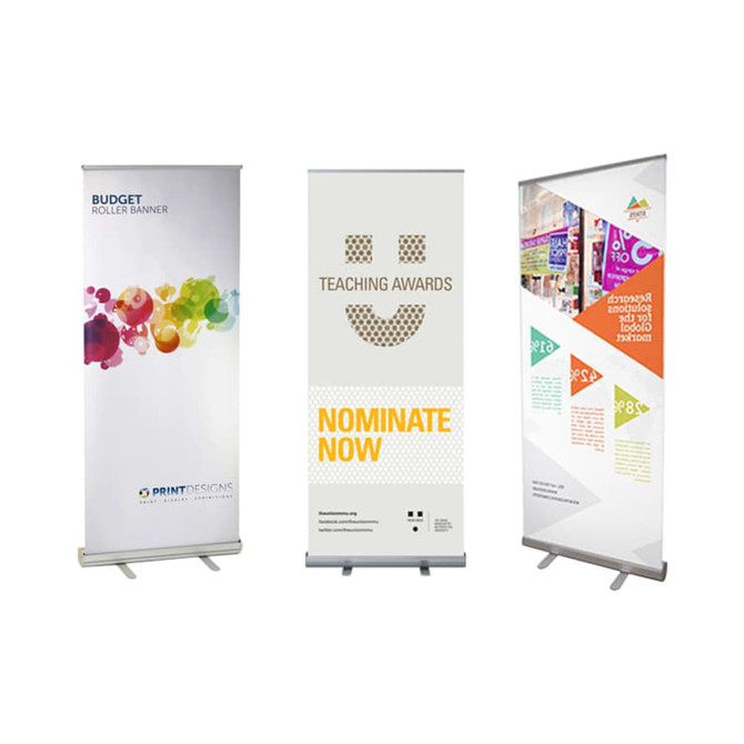 Three pull-up banners in various designs: a colourful abstract pattern, a teaching awards banner, and a geometric promotional banner.