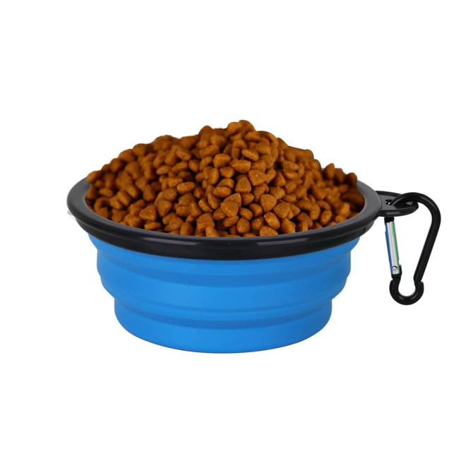A collapsible blue silicon bowl filled with brown pet food, featuring a black rim and a carabiner.