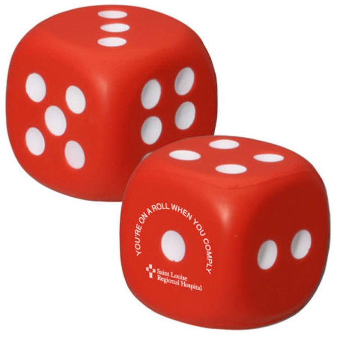 A red dice-shaped stress reliever with white dots, featuring a logo on one side.