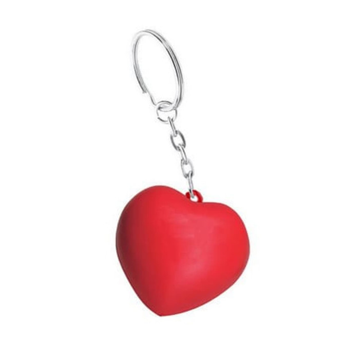 A red heart-shaped stress reliever attached to a metal keyring with a small chain.