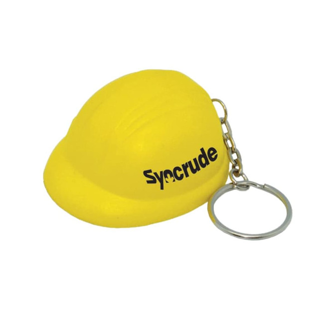 A yellow helmet-shaped stress reliever attached to a keyring, featuring a logo.