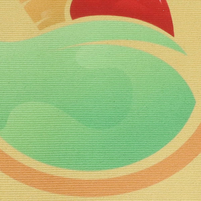 A textured mat featuring abstract shapes in green, yellow, and red, with a branding logo present.