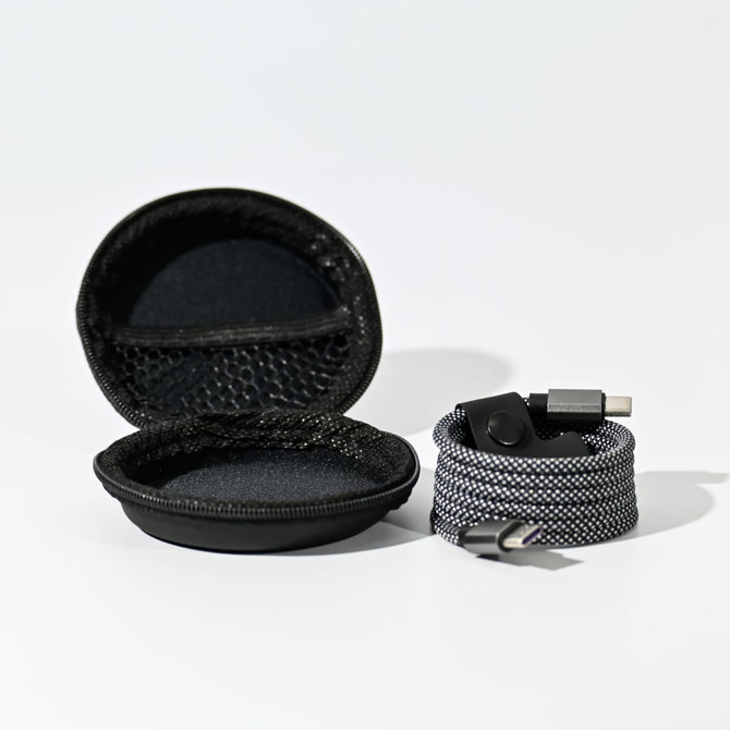 A charging cable with a black and grey braided design, accompanied by a black protective case.
