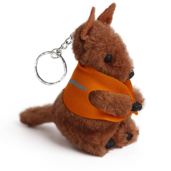 A brown plush kangaroo toy with an orange vest, featuring a keychain attachment.