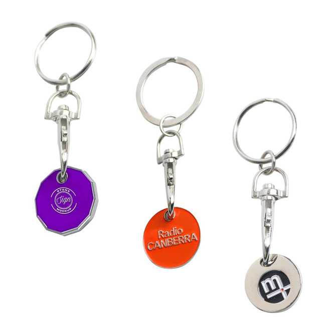 Three enamel trolley coin keyrings in purple, orange, and silver, each attached to a metal keyring.
