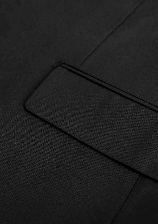 A black jacket featuring a sleek design with a subtle pocket detail and smooth fabric finish.
