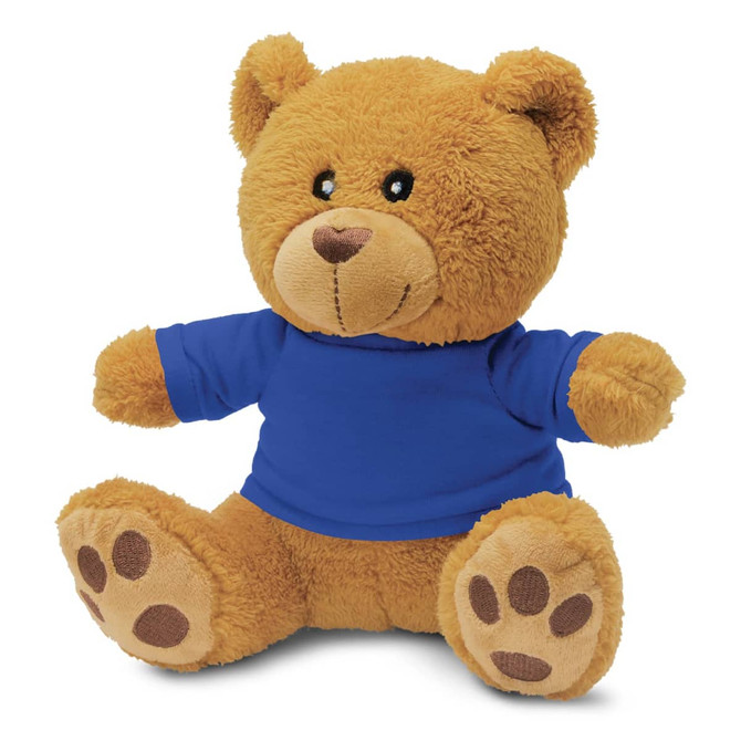 A plush teddy bear in brown with a blue shirt, featuring soft texture and paw details. It has a branded logo.
