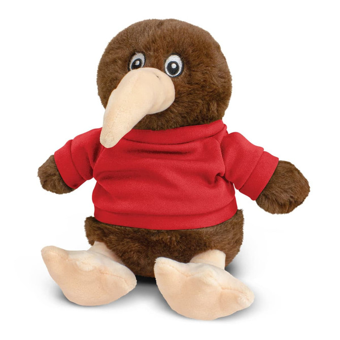 A brown plush kiwi toy wearing a red shirt, featuring large eyes and a long beak. It has a logo on its shirt.
