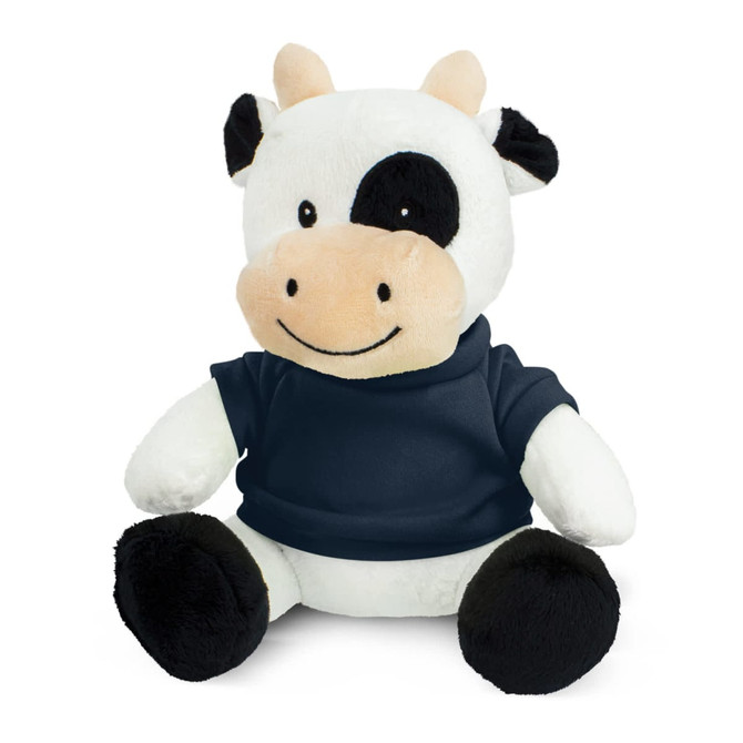 A plush cow toy with black and white fur, wearing a navy blue shirt, sitting upright with a friendly expression.