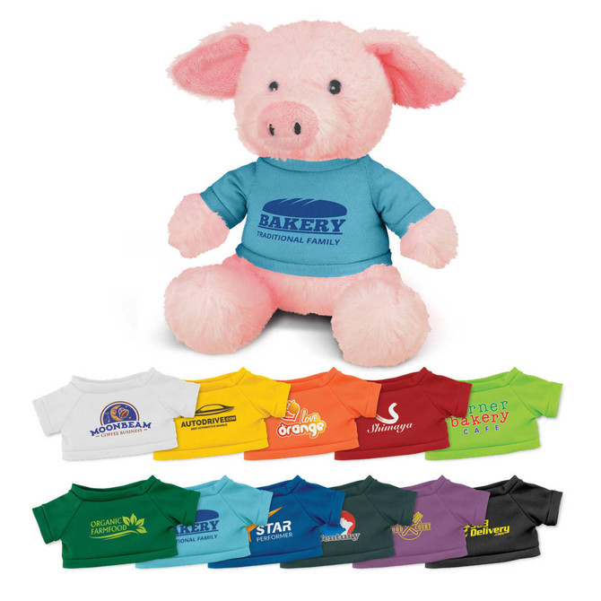 A pink plush pig toy wearing a blue shirt, accompanied by various colourful miniature shirts in different shades.